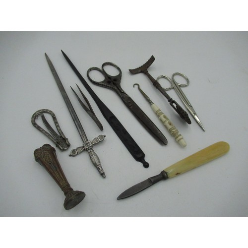 59 - Collection of items including letter openers, a seal, tweezers and a glove button hook etc.