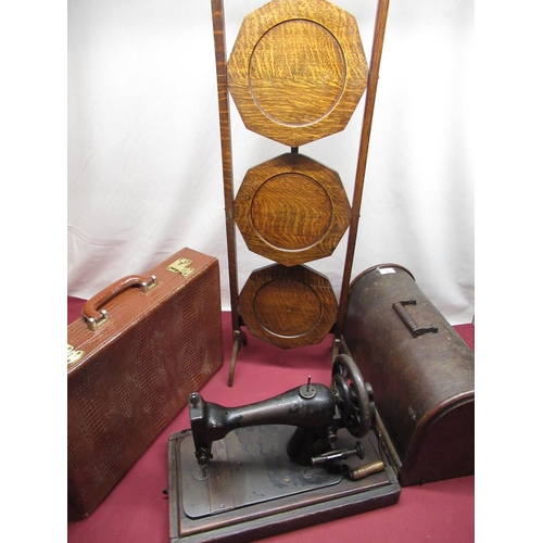 130 - Tan crocodile skin leather attache case, Singer hand sewing machine in a domed topped oak case, and ... 