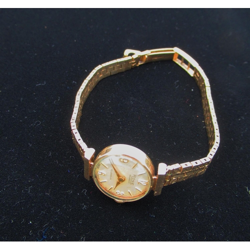 20 - Ladies Rose gold wristwatch, 9ct gold case on integral bracelet stamped .375 snap on case back hallm... 