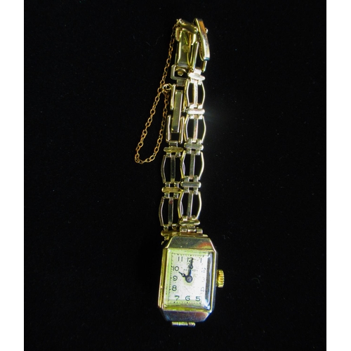 21 - Record Ladies gold wristwatch 9ct gold case on integral gold bracelet stamped .375 snap on hinged ca... 