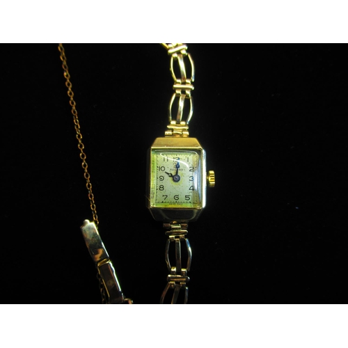 21 - Record Ladies gold wristwatch 9ct gold case on integral gold bracelet stamped .375 snap on hinged ca... 