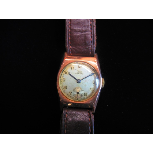 22 - Record hand wound wristwatch, exagonal 9ct gold case on leather strap, snap on case back hallmarked ... 