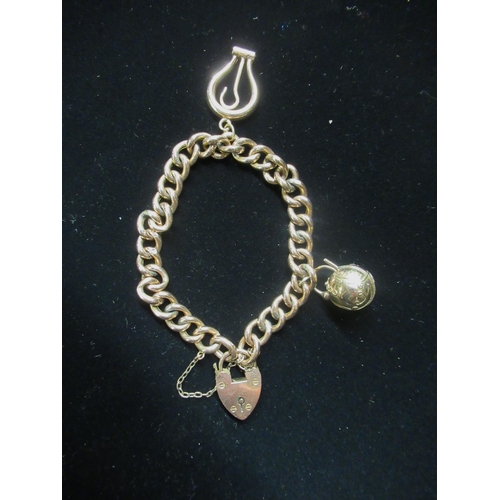 34 - 9ct rose gold charm bracelet with heart padlock clasp and safety chain stamped, 9C 17.6g