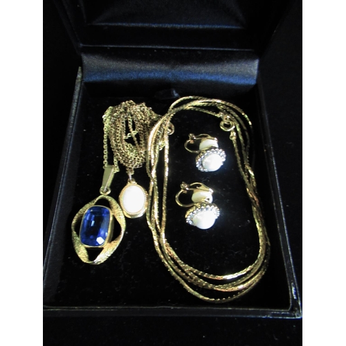 38 - Rolled gold chain link necklace on spring ring clasp with blue stone oval pendant and a collection o... 