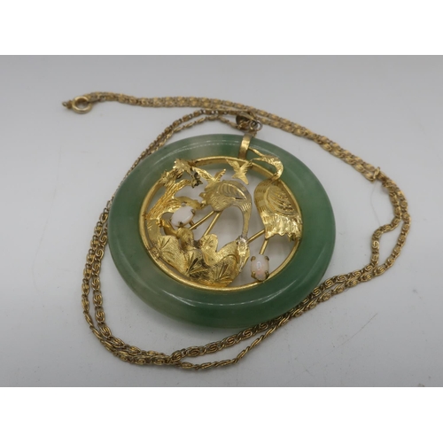 85 - C20th Chinese circular jade pendant with inset gold plated open work study of storks with two mounte... 