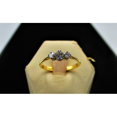 24 - 18ct gold three stone diamond ring Size R stamped 18, 2.6g gross