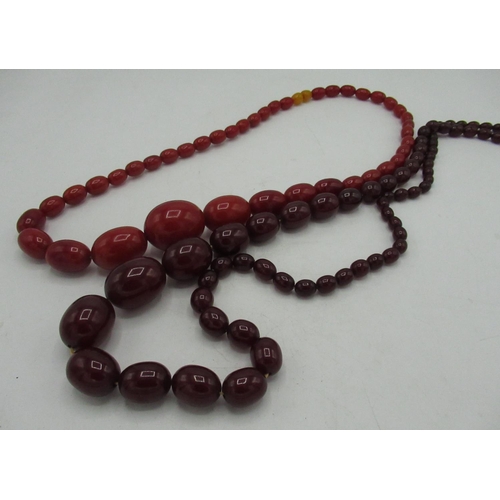 98 - C19th red amber graduated bead necklace, L30cm and a C19th ruby amber graduated bead necklace L46cm ... 