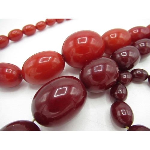 98 - C19th red amber graduated bead necklace, L30cm and a C19th ruby amber graduated bead necklace L46cm ... 