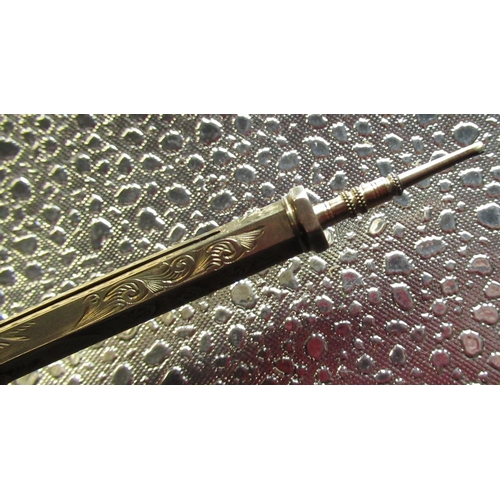 99 - Late Victorian rolled gold combination propelling pencil and pen of hexagonal form with bright cut d... 
