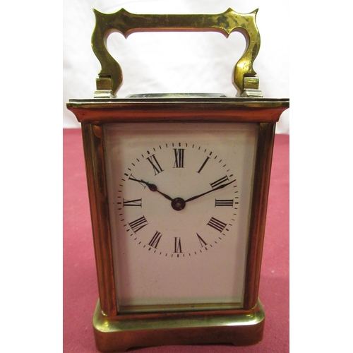129 - Late C19th French brass gorge cased carriage time piece with beveled glass panels, later replacement... 