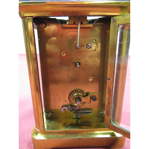 129 - Late C19th French brass gorge cased carriage time piece with beveled glass panels, later replacement... 