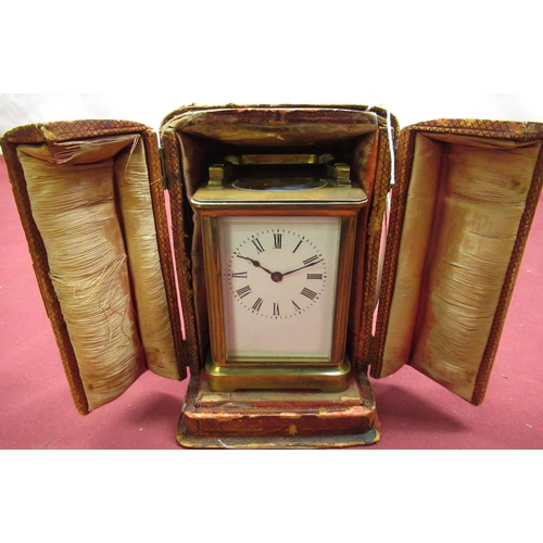 129 - Late C19th French brass gorge cased carriage time piece with beveled glass panels, later replacement... 