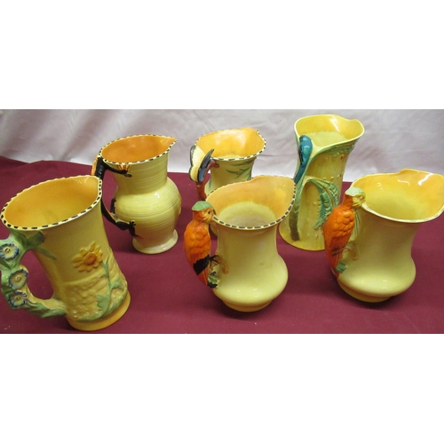 141 - Art Deco Burgess & Leigh Ltd Burleigh Ware jugs: three parrot handled jugs, butterfly handled jug, d... 