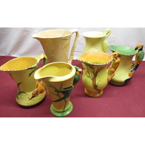 144 - Art Deco Burgess & Leigh Ltd Burleigh Ware jugs: squirrel handle, parrot handles, and three other (5... 