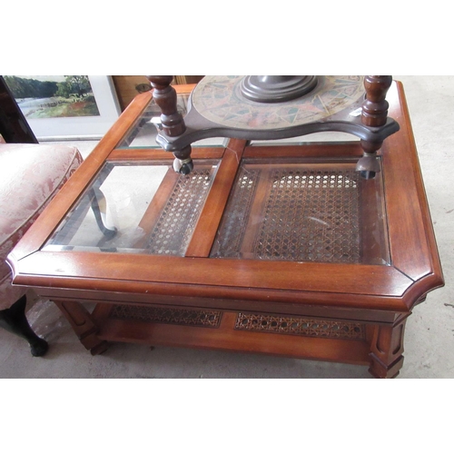 369 - Colonial style coffee table, square top with four inset bevel brass panels on square moulded support... 