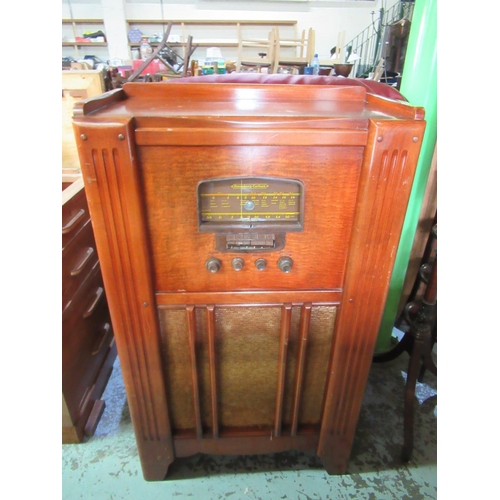 414 - Stromberg-Carlson Cabinet radio with magic eye, walnut case with Bakelite dial and knobs W61cm D30cm... 