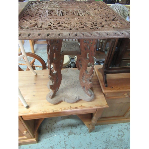 416 - 20th C Indian occasional table the square top carved with elephants foliage and deity figures on pie... 