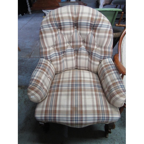 433 - Victorian deep button back armchair on carved cabriole supports in reupholstered checked fabric