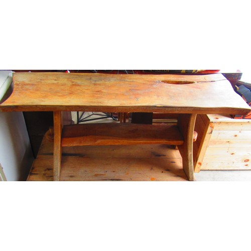 384 - Rustic pine bench on out splayed supports joined by a stretcher