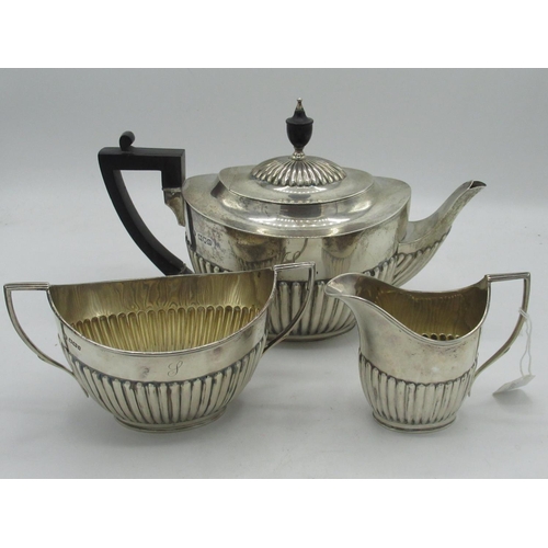 2083 - Victorian hallmarked silver matched three-piece tea service, of half lobed ovoid form, tea pot with ... 