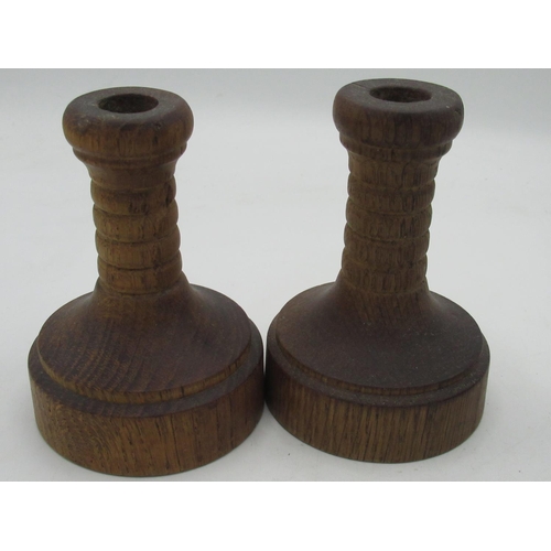 2059 - Yorkshire Oak - pair of turned oak candlesticks with urn columns on circular bases H11cm and a simil... 