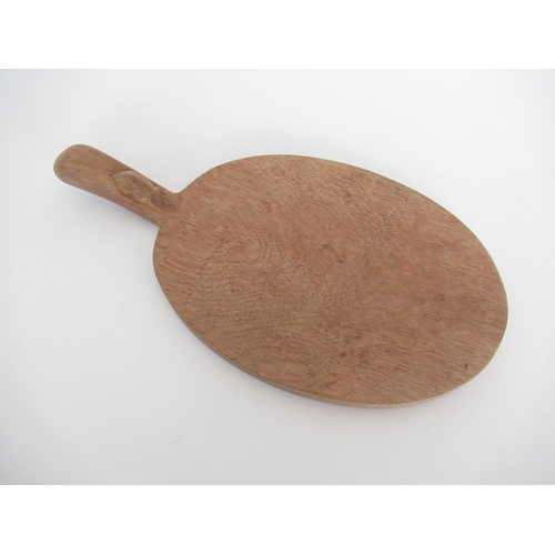 2058 - Robert Mouseman Thompson - oak oval cheeseboard, handle carved with signature mouse, L39cm W21cm