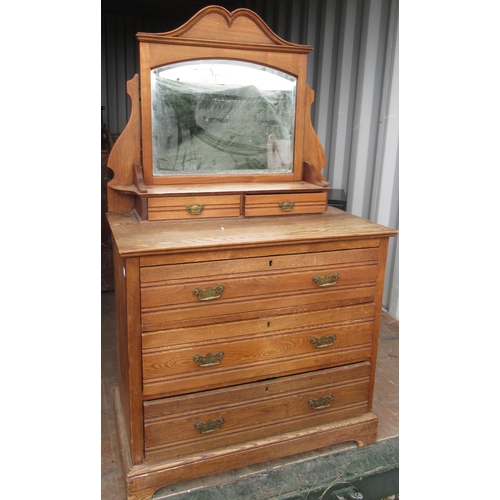 521 - Edwardian ash dressing chest with arched mirror above two freize drawers and three long drawers, on ... 