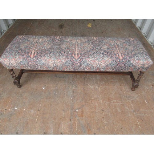 512 - C20th rectangular long stool, upholstered in Liberty type print on barley twist supports joined by s... 