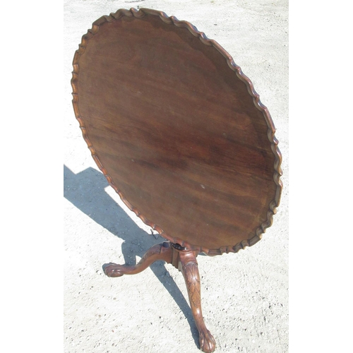 2310 - Geo. III mahogany tripod tea table, circular tilt top with pie crust border on fluted tapering colum... 