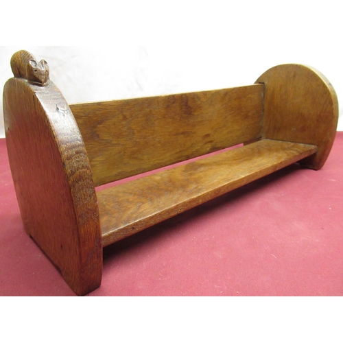 2050 - Robert Mouseman Thompson - oak bookrack on unusual arched end supports, carved with signature mouse ... 