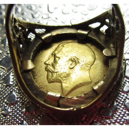 523 - Rav Wilding Collection - Geo. V 1912 gold half sovereign ring in 9ct gold mounts with scroll detail