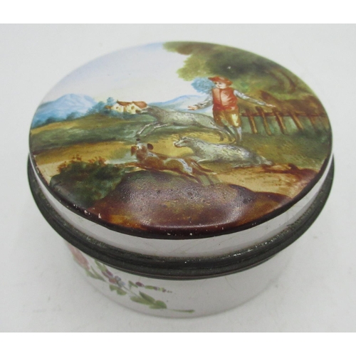 2133 - C19th Staffordshire enamel circular box, cover decorated with a study of a huntsman with three runni... 