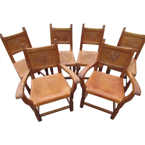 2067 - Thomas Gnomeman Whittaker - set of six oak dining chairs, solid panel backs carved with the arms of ... 