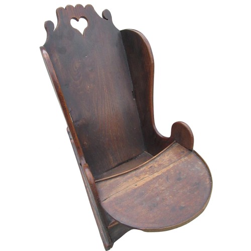 2327 - Early C19th child's elm wing back rocking chair, with heart shaped pieced cresting solid seat with r... 