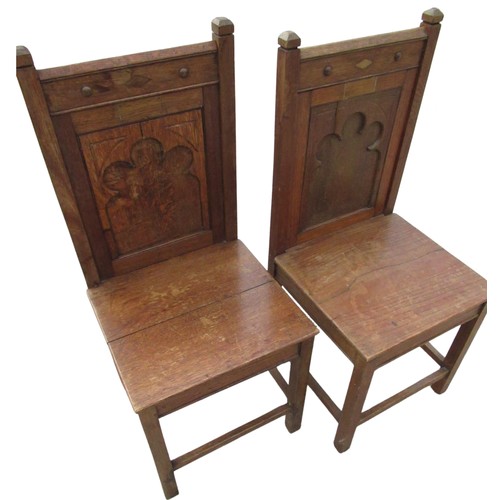 2328 - Pair of late Victorian oak hall chairs, solid backs with blind fret carved Gothic panels, solid seat... 