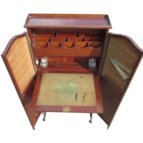 2317 - Unusual C20th mahogany writing cabinet, with galleried top and fall front with stationary compartmen... 