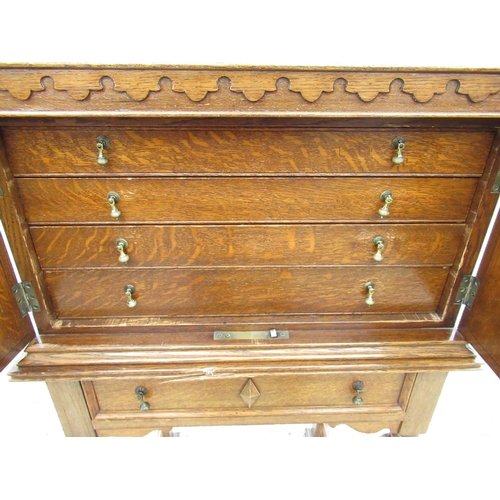 2348 - C20th oak cabinet, two doors enclosing three drawers with a canteen of EPNS Dubarry pattern cutlery ... 