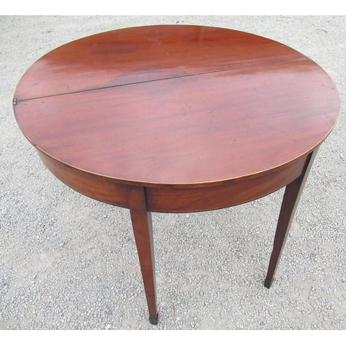 2351 - George III rosewood banded and boxwood strung mahogany folding tea table, on twin gate action square... 