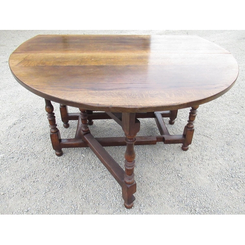 2357 - Titchmarsh & Goodwin oak gate leg dining table with two D shaped leaves and end drawer on baluster t... 