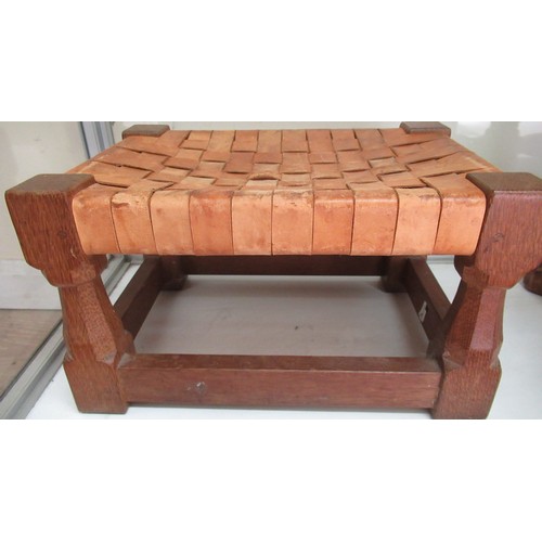2036 - Robert Mouseman Thompson - oak rectangular footstool with plaited leather top, on tapering octagonal... 