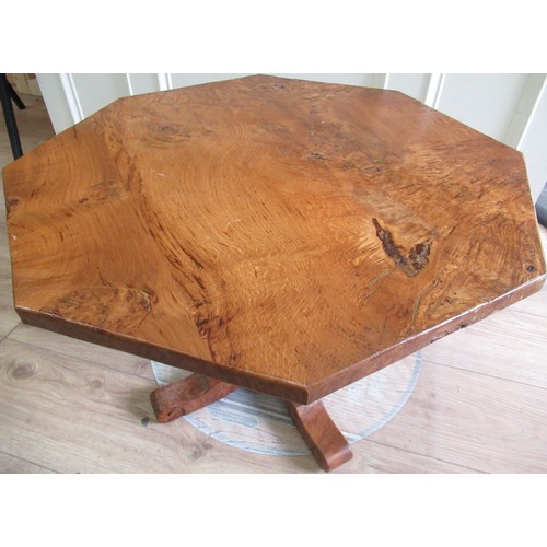 2078 - Bob Wrenman Hunter - an oak coffee table, burr octagonal top on leaf carved column support with X ba... 