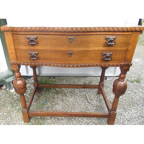 2345 - C20th oak cabinet, serpentine front above two drawers containing a canteen of EPNS Dubarry pattern c... 