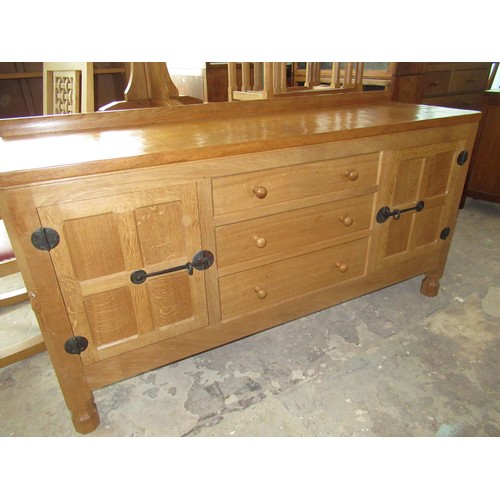 2001 - Robert Mouseman Thompson - oak sideboard, adzed top with raised back above three drawers with turned... 