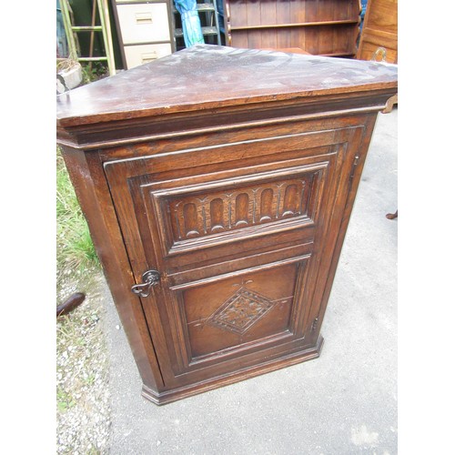 153 - Small C18th style oak corner cupboard with lozenge and arcade carved door, W59 D33 H80cm