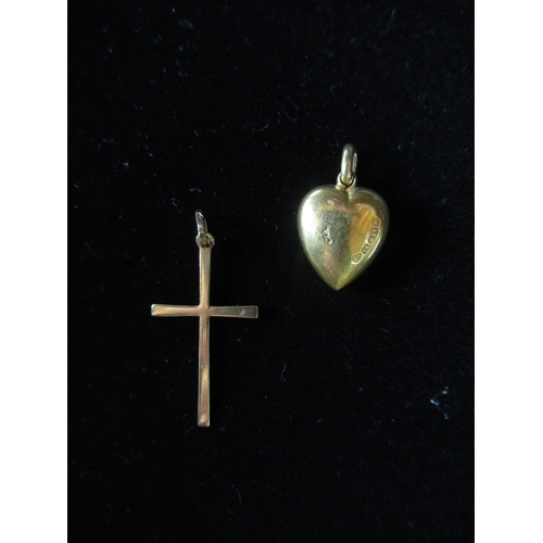 12 - 18ct gold cross pendant stamped 750 L3cm, a 15ct gold heart shaped pendant with inset diamond hallma... 