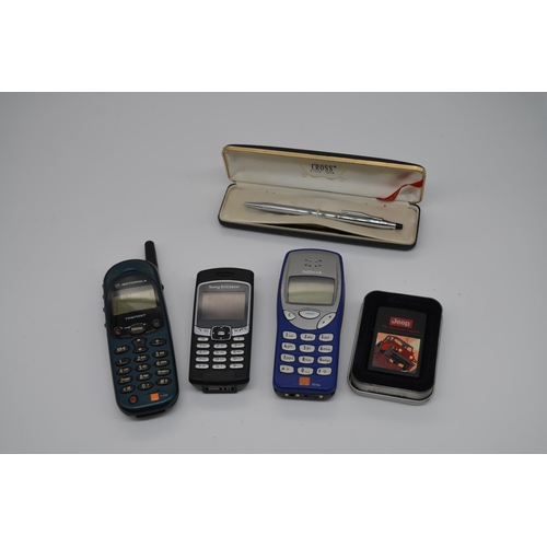 248 - Collection of phones including Nokia, Sony Ericsson etc, a Cross pen and a Jeep Zippo lighter in a p... 