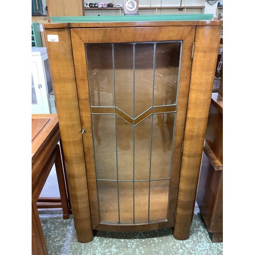 117 - 1920's deco walnut china cabinet enclosed by single lead glazed door