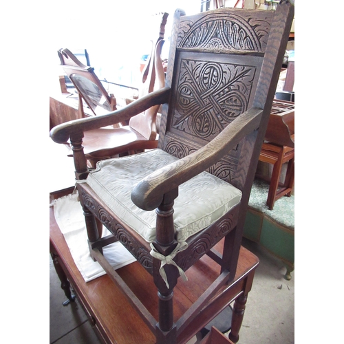 515 - Oak wainstock style chair with carved detail to the front and back