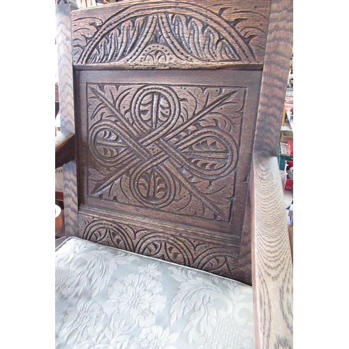 515 - Oak wainstock style chair with carved detail to the front and back