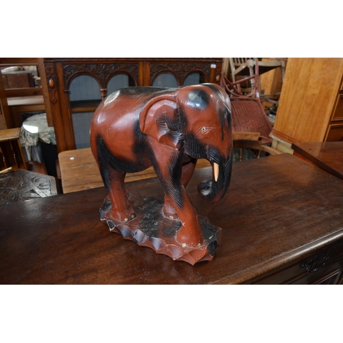 198 - Carved wood figure of an Elephant, two planters in the form of hay wagons (3)